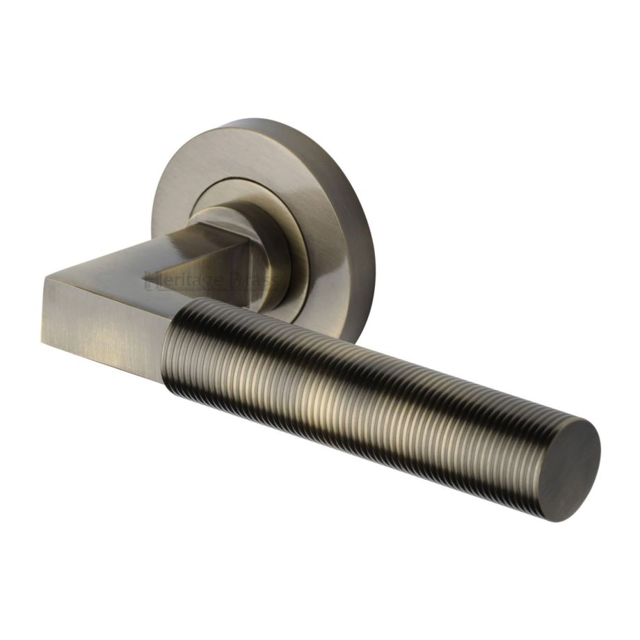 Heritage Brass - Spectral Door Handle on Round Rose