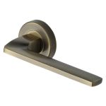 Heritage Brass - Metro Angled Door Handle on Round Rose