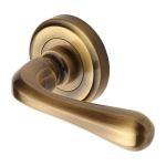 Heritage Brass - Charlbury Door Handle on Round Rose